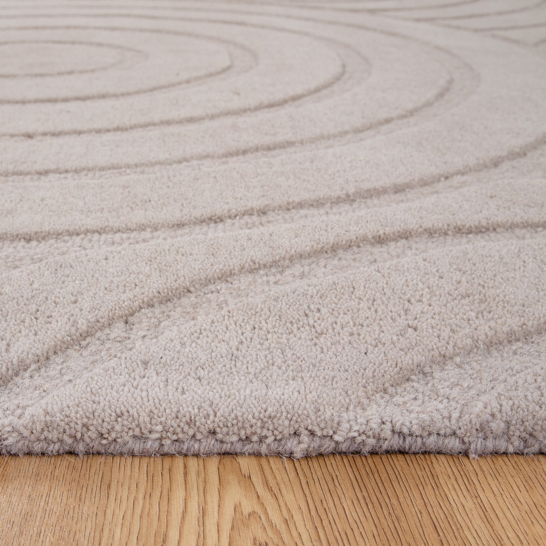 Get This Luxurious Les Nomades Beige Ellipse Hand - Tufted Wool Rug for Your Modern Space