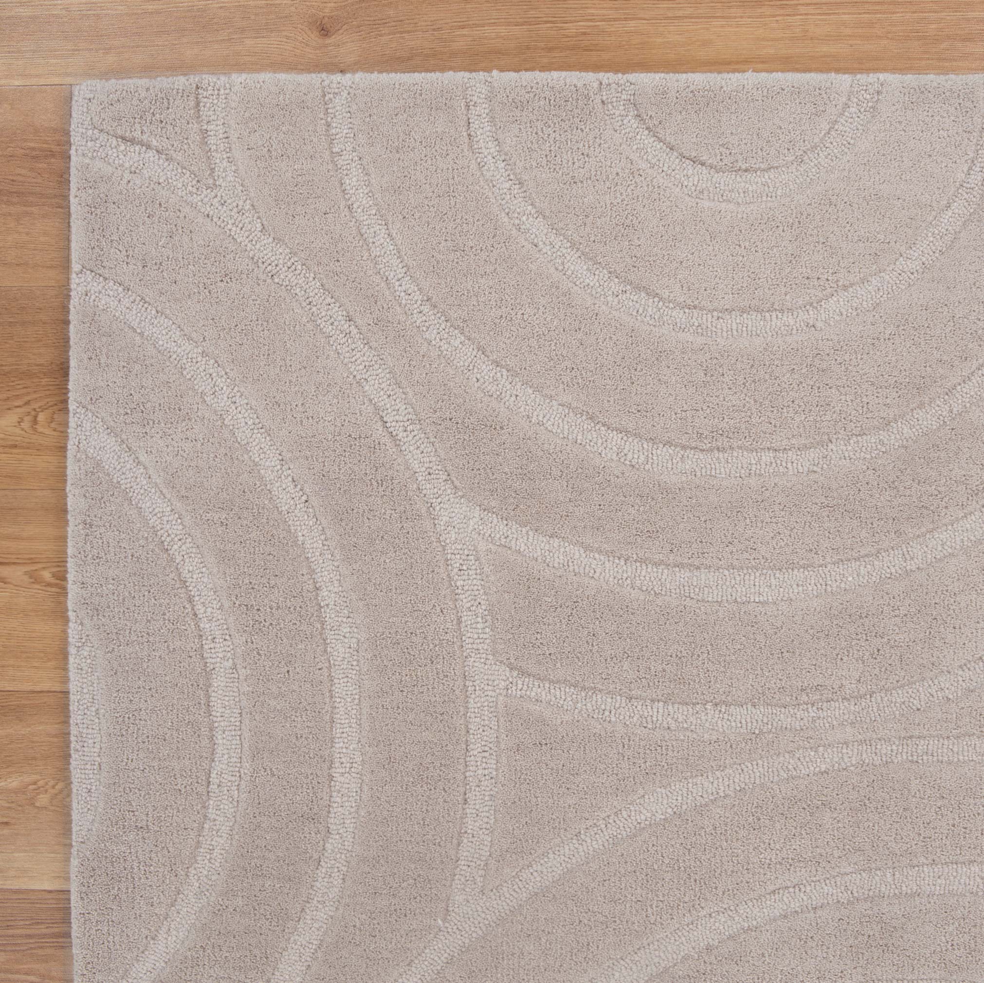 Get This Luxurious Les Nomades Beige Ellipse Hand - Tufted Wool Rug for Your Modern Space